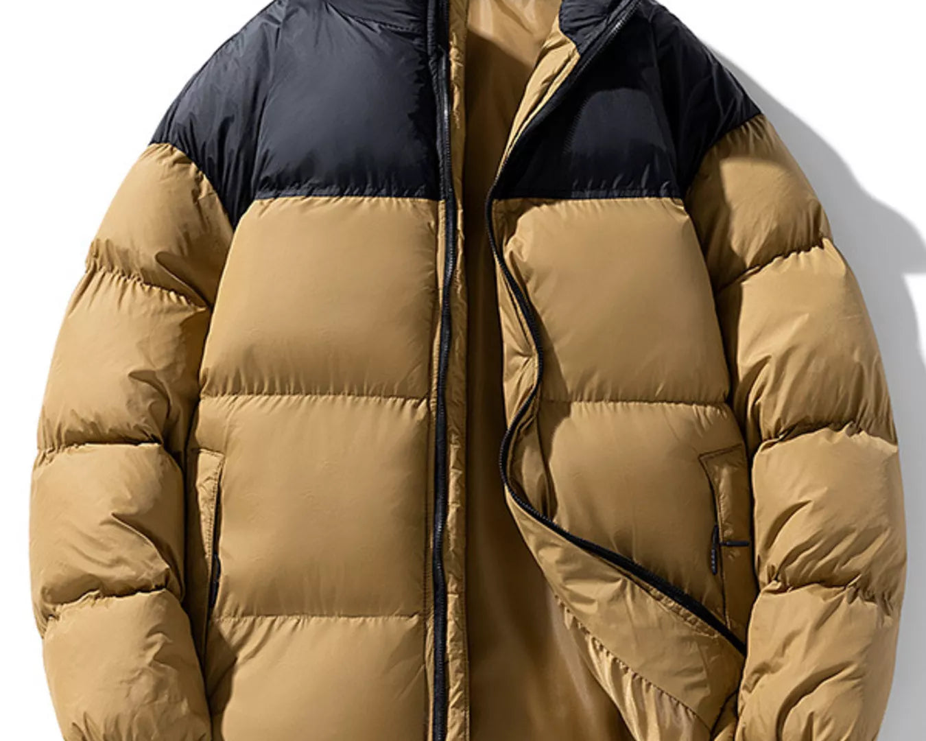 NEWYORKLISTED ATLAS MEN’S COLLECTION: Two-tone puffer jacket with black collar and beige body on a white background