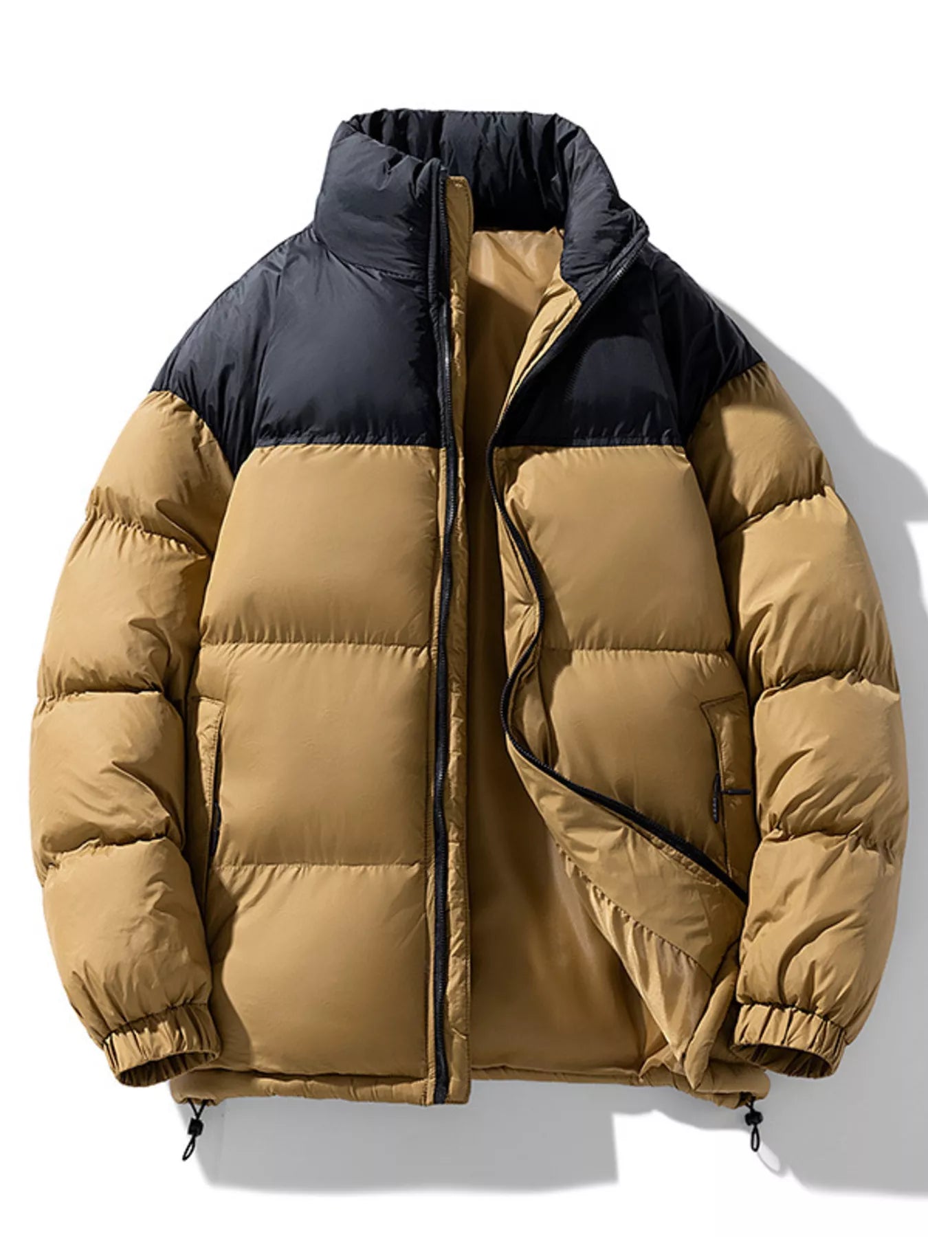 NEWYORKLISTED ATLAS MEN’S COLLECTION: Two-tone puffer jacket with black collar and beige body on a white background