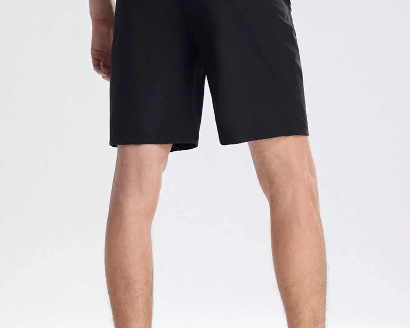 NEWYORKLISTED ATLAS MEN's COLLECTION: Person wearing black shorts on a white background