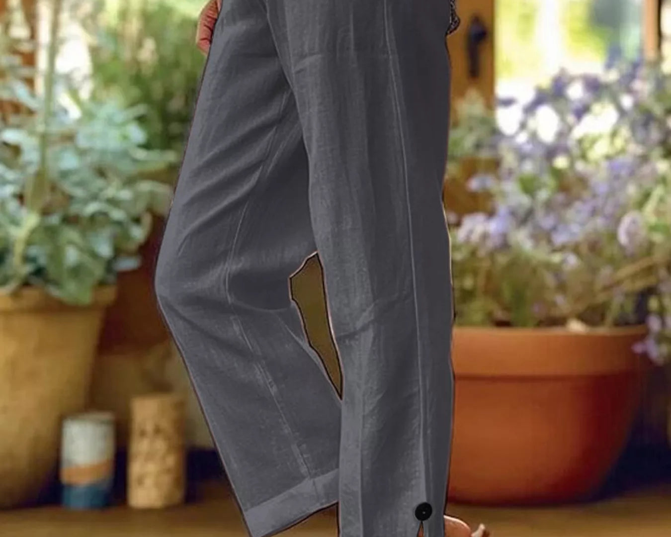 NEWYORKLISTED STYLE COLLECTION: Person wearing gray wide-leg pants with a blurred indoor background