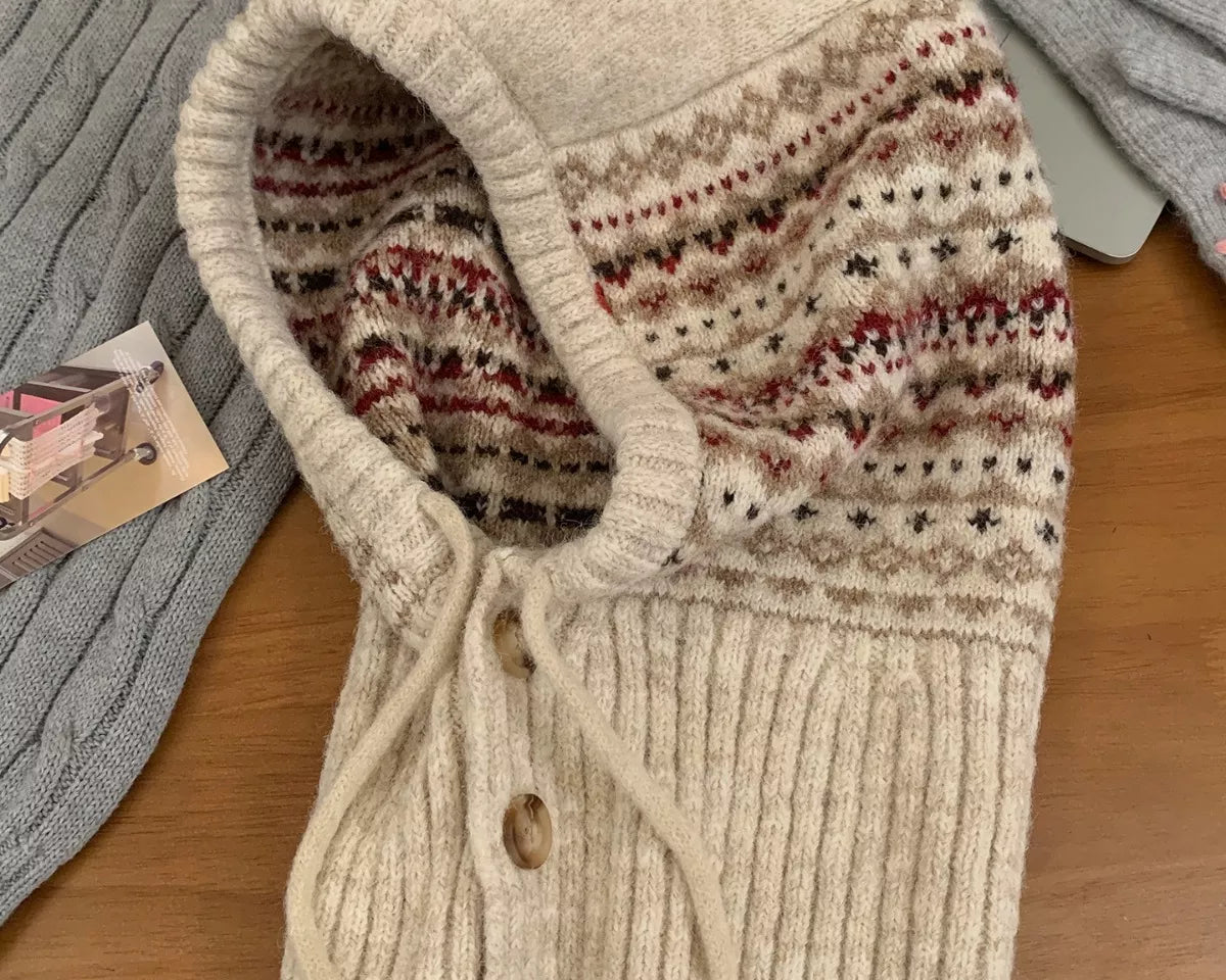 NEWYORKLISTED STYLE COLLECTION: Drawstring Knitted Winter Hat – Cozy, Chic & Cold-Weather Ready: Knitted cardigan with patterned hood on a wooden surface