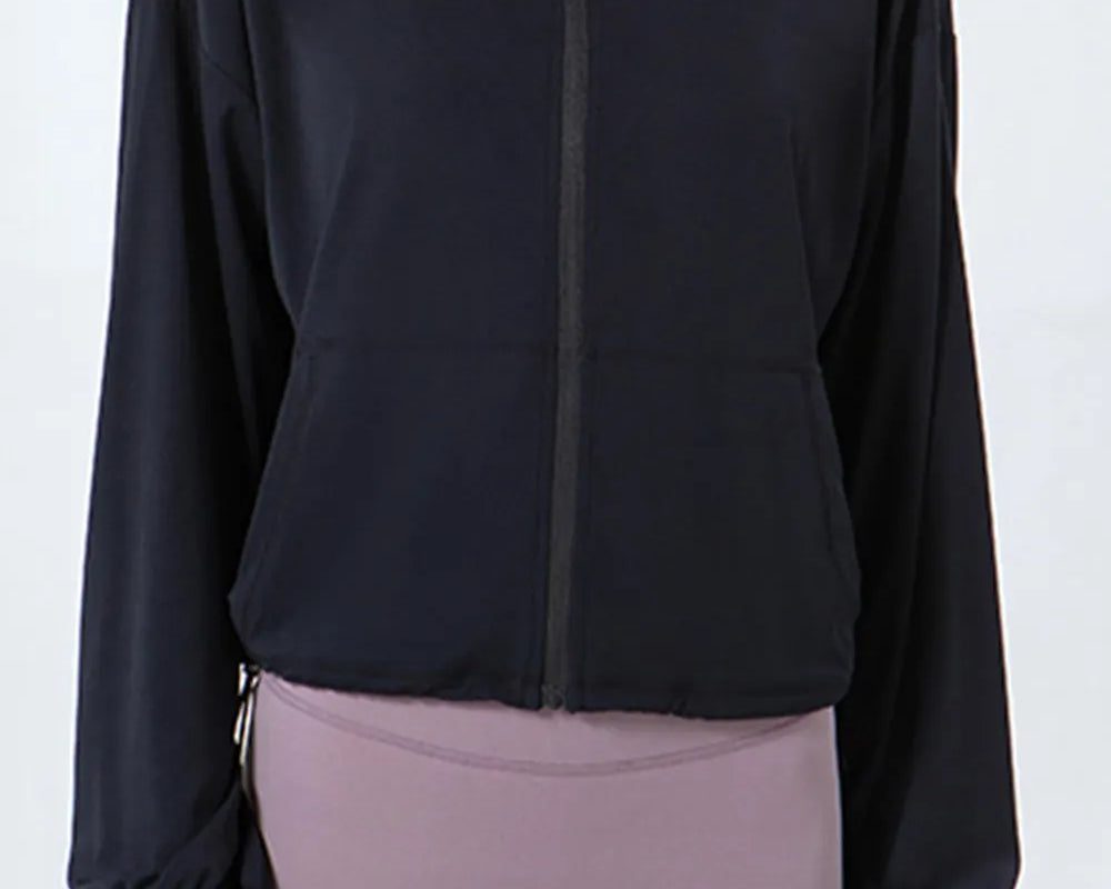 NEWYORKLISTED ACTIVEWEAR COLLECTION: Black jacket and gray leggings on a white background