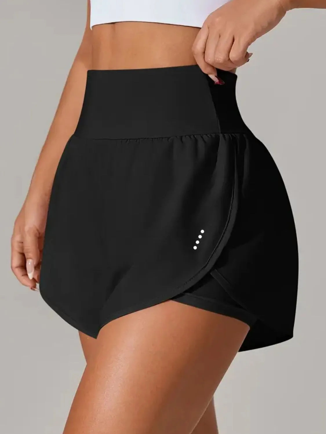 NEWYORKLISTED Activewear: Black athletic skirt worn by a person on a gray background