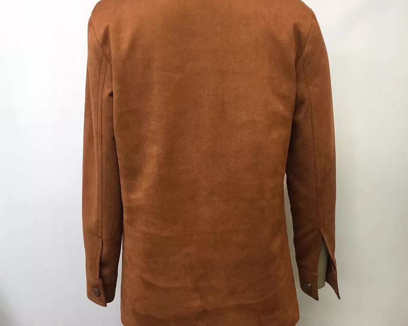 NEWYORKLISTED STYLE COLLECTION: Brown suede jacket on a mannequin against a white background