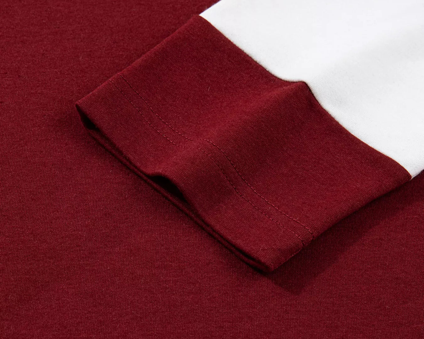 Close-up of a burgundy fabric with a white trim pocket