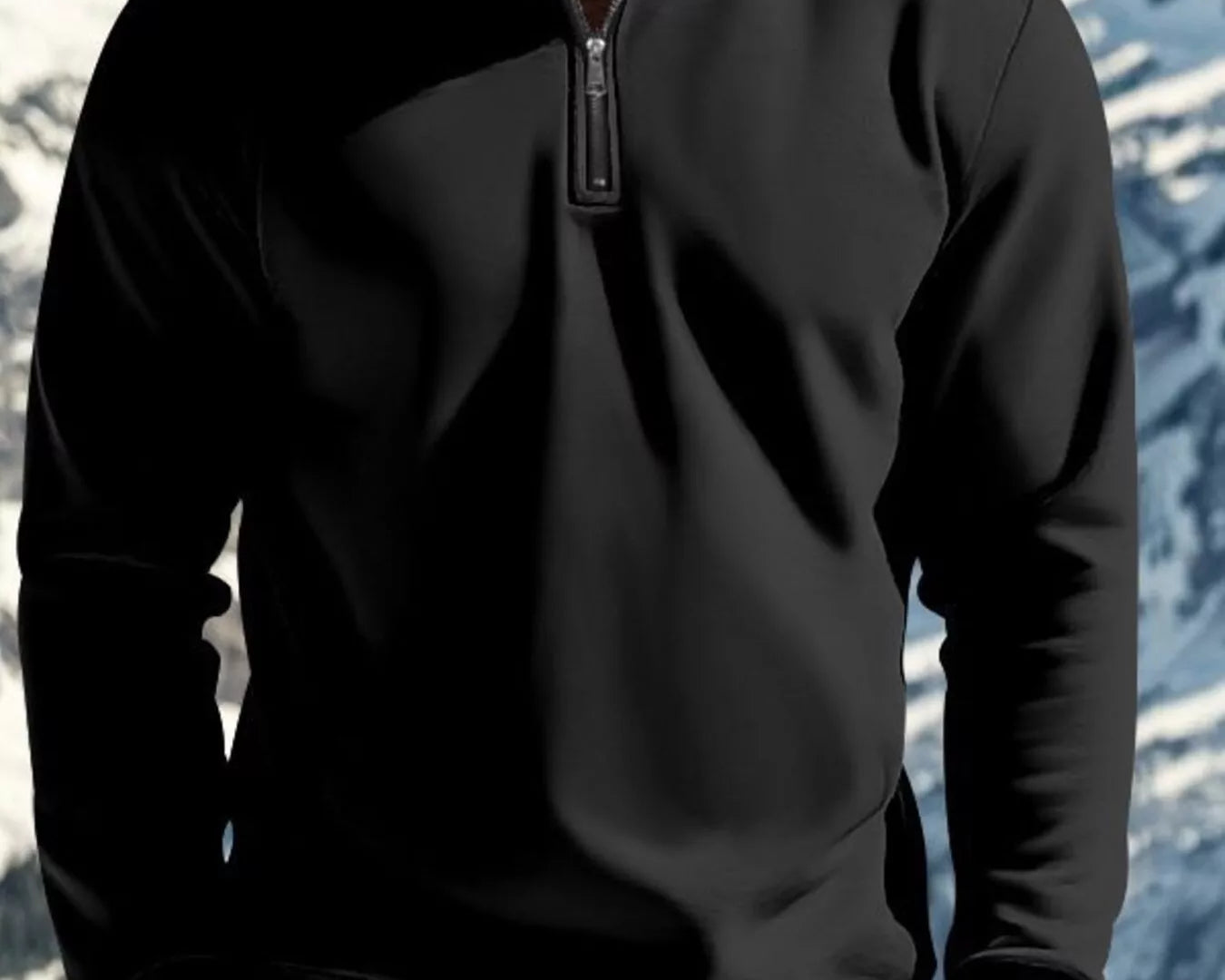 NEWYORKLISTED ATLAS MEN'S COLLECTION: Person wearing a black quarter-zip sweatshirt with a mountainous background