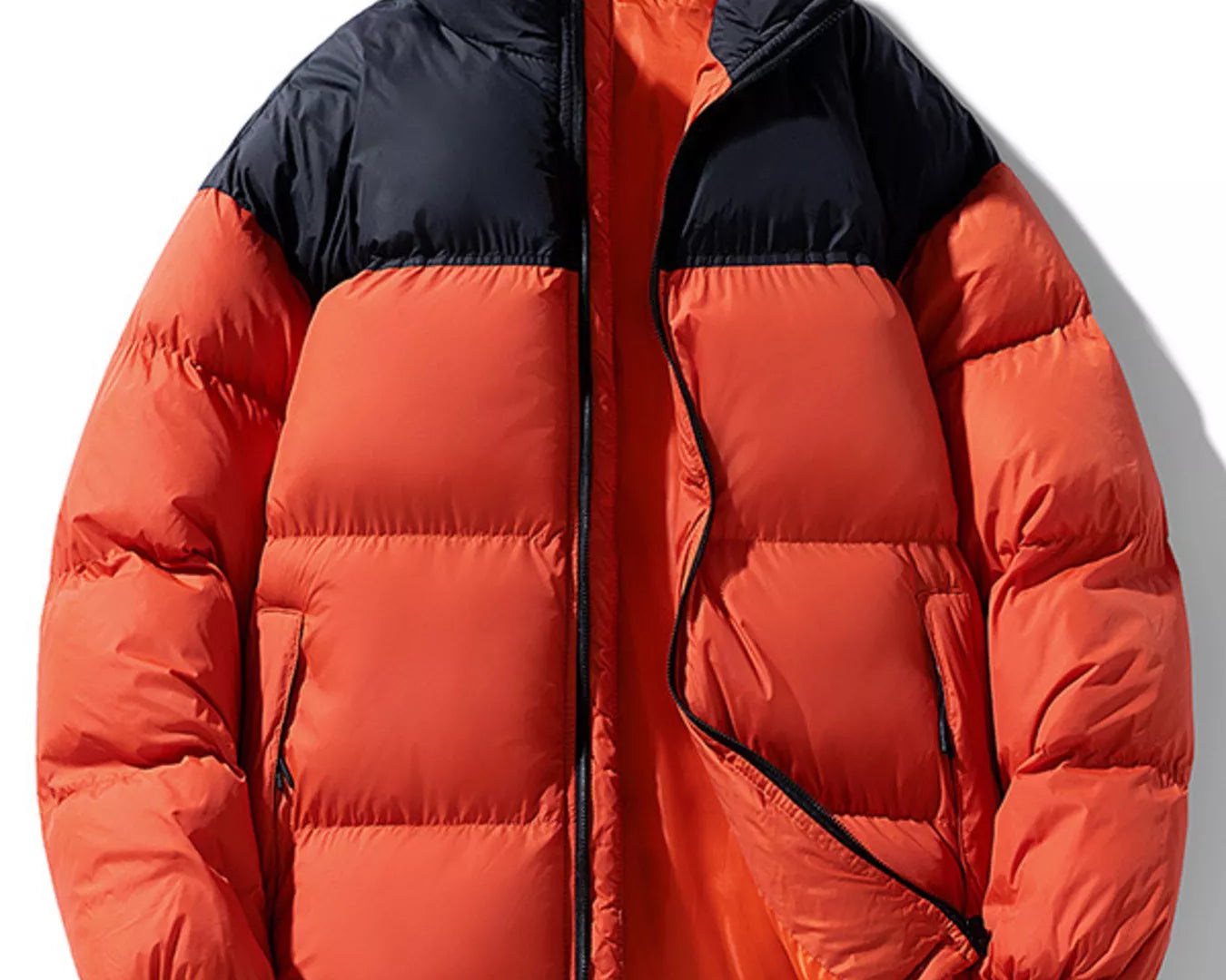NEWYORKLISTED ATLAS MEN’S COLLECTION: Orange red and black puffer jacket on a white background