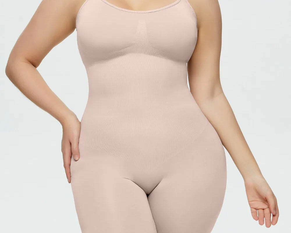 NEWYORKLISTED Intimate Apparel Collection: Woman wearing a beige shapewear bodysuit on a white background