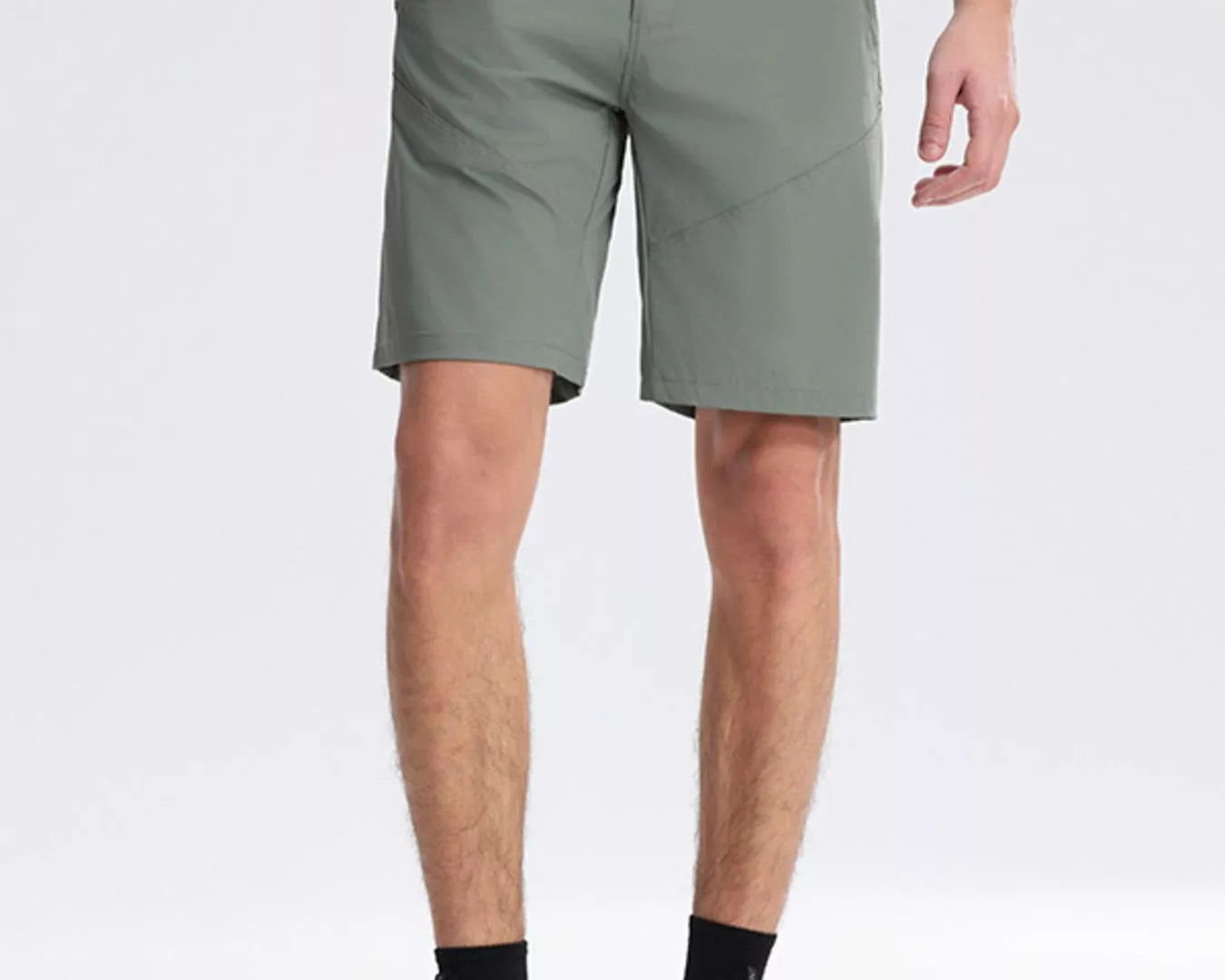 NEWYORKLISTED ATLAS MEN's COLLECTION: Person wearing green shorts on a white background