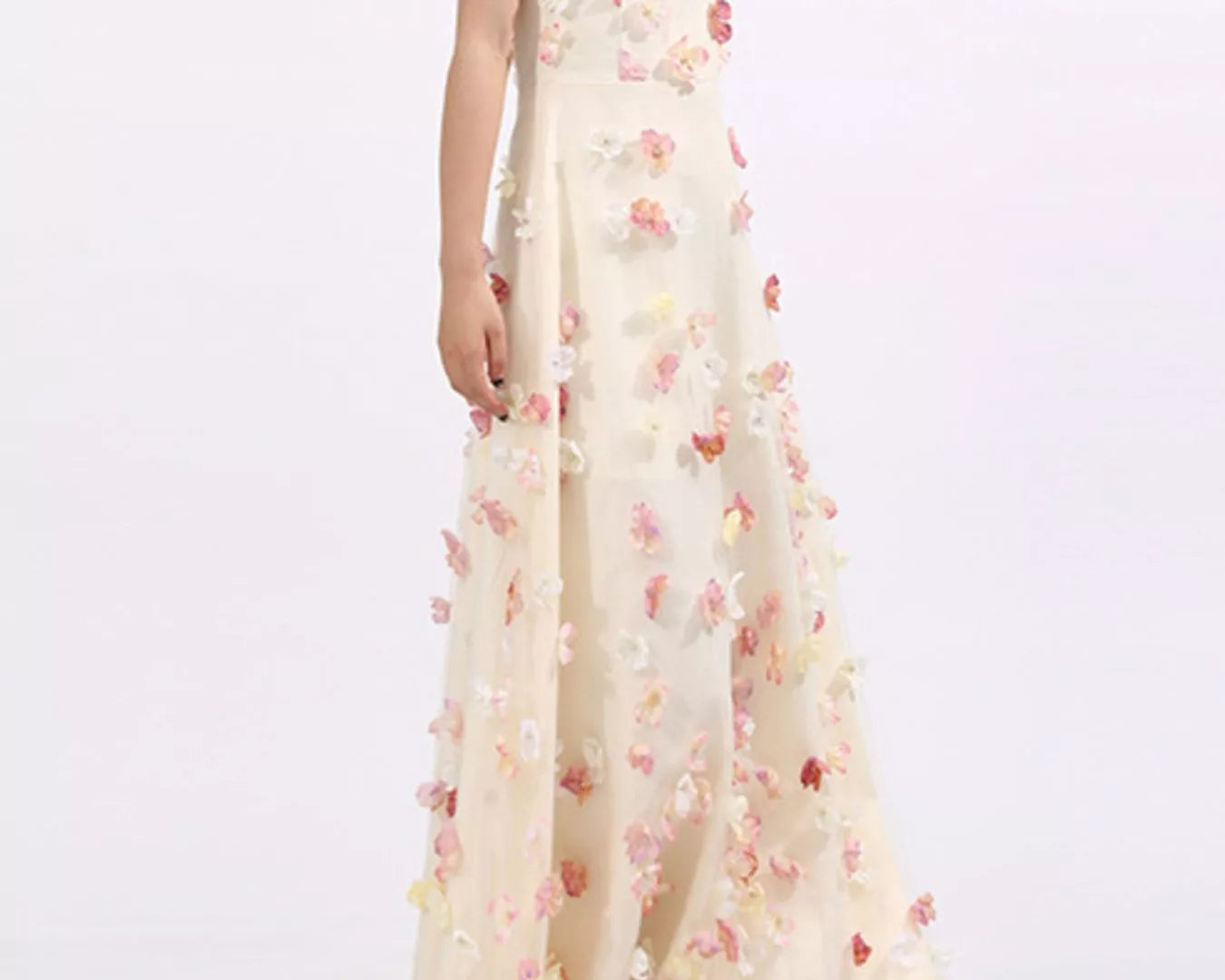 NEWYORKLISTED STYLE COLLECTION: Woman wearing a strapless floral gown on a white background