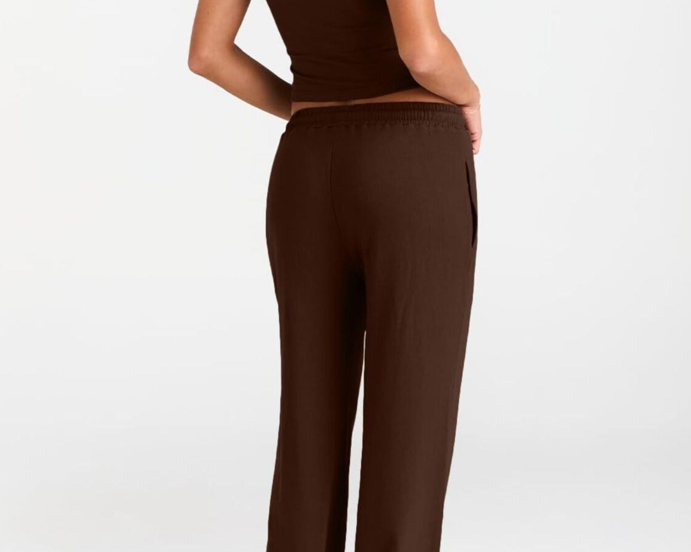 NEWYORKLISTED COMFORT COLLECTION: Person wearing a brown outfit on a white background