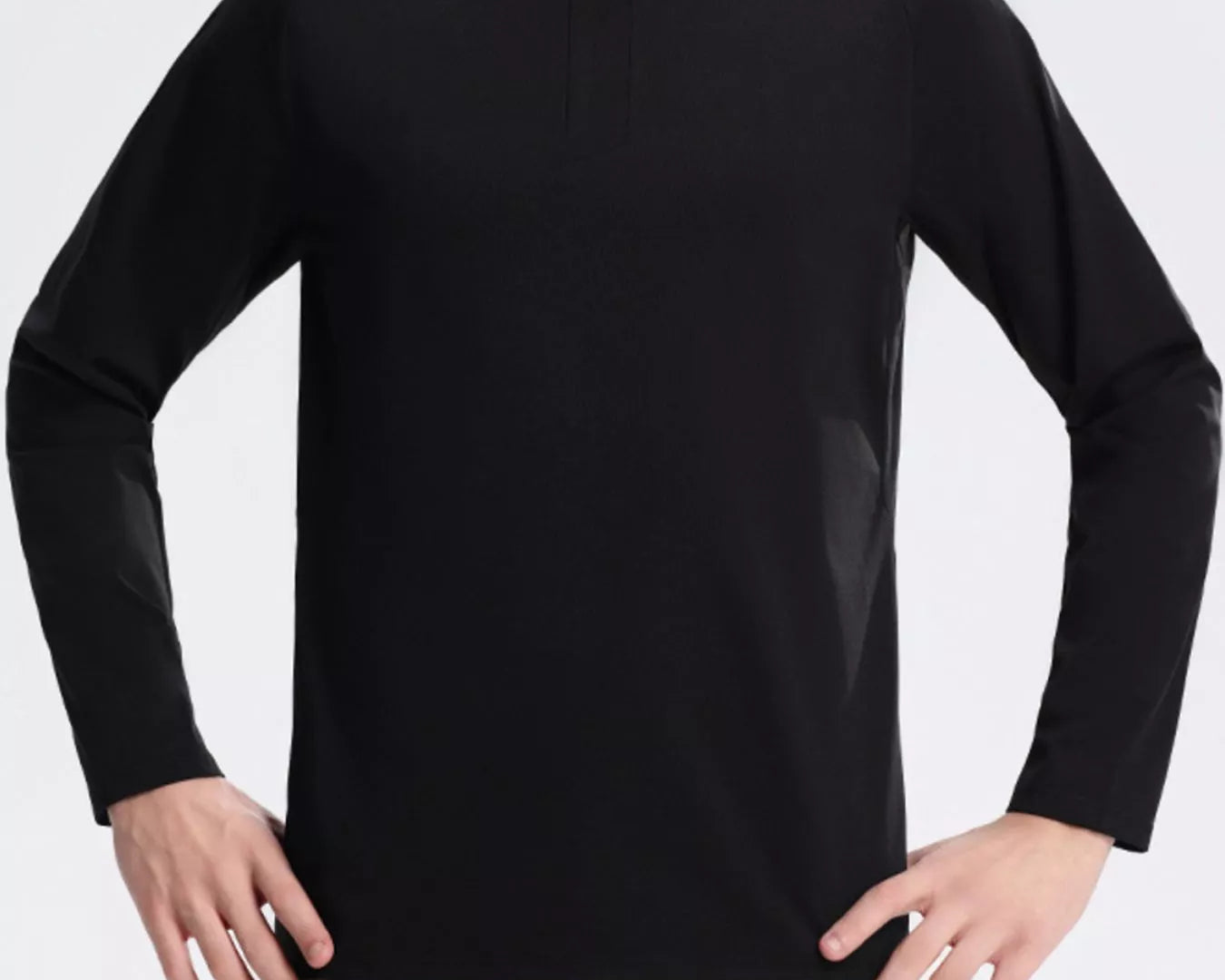 NEWYORKLISTED ATLAS MEN's COLLECTION: Person wearing a black long-sleeve shirt and beige pants on a light gray background