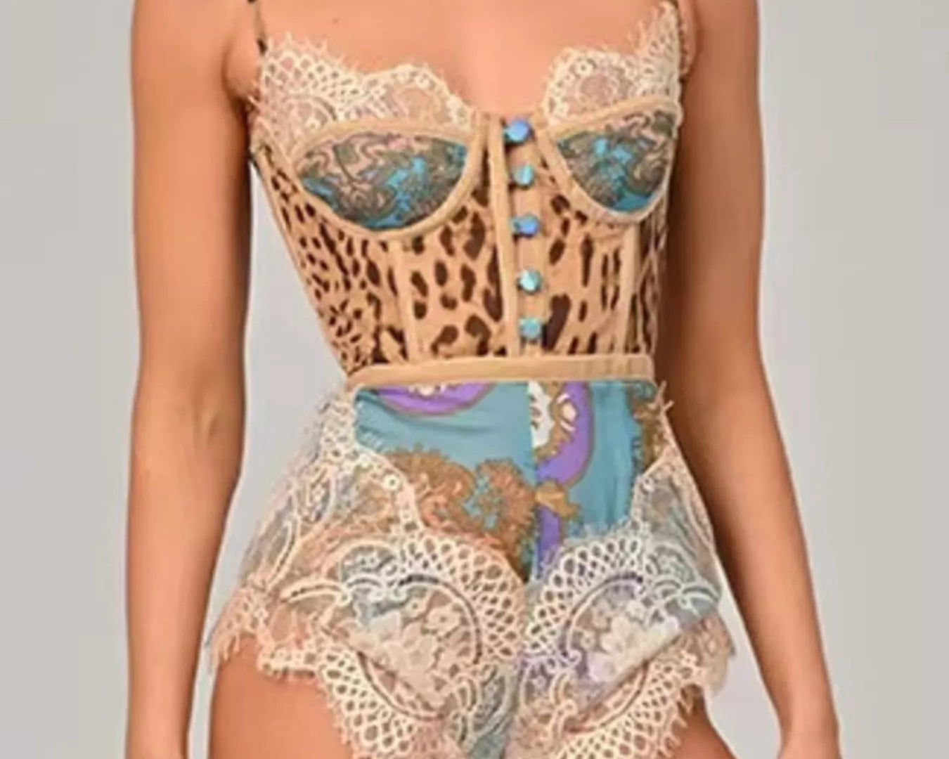 NEWYORKLISTED INTIMATE APPAREL: Lace and leopard print top with matching shorts on a neutral background