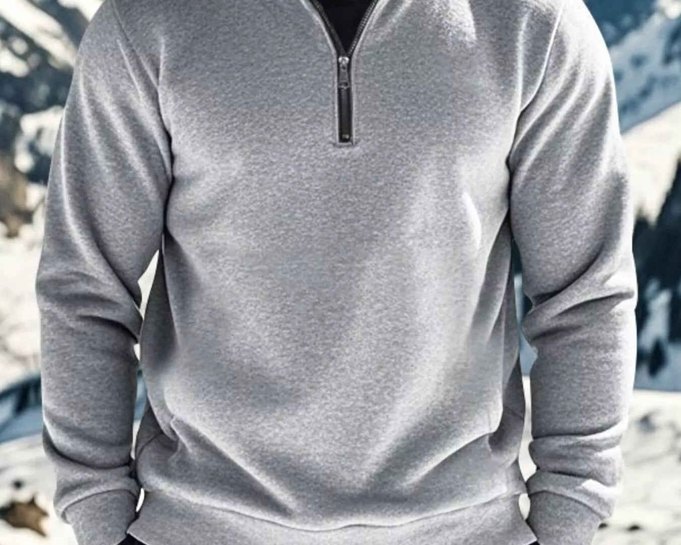 NEWYORKLISTED ATLAS MEN'S COLLECTION: Person wearing a gray pullover with a mountainous background