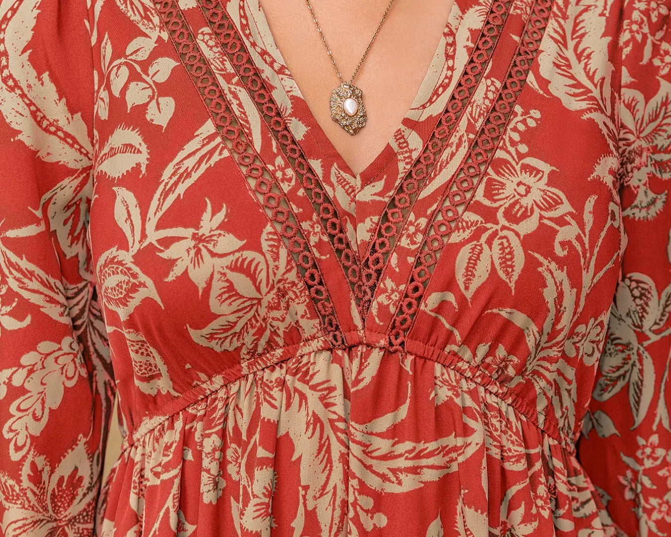 NEWYORKLISTED STYLE COLLECTION: Red floral dress with a necklace on a neutral background