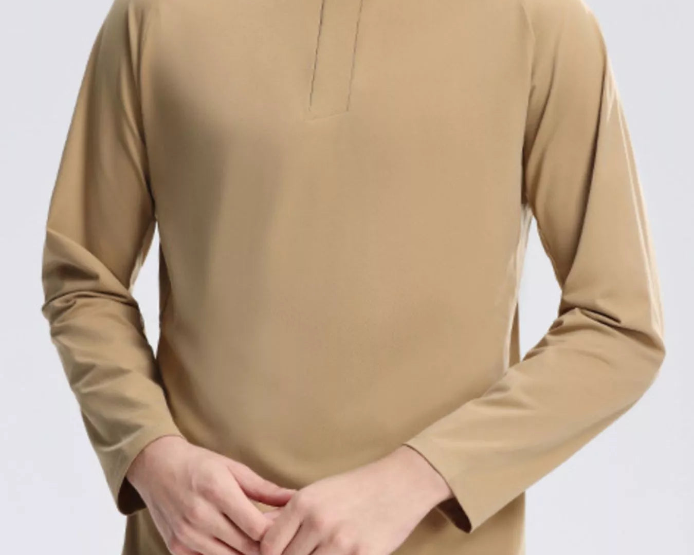 NEWYORKLISTED ATLAS MEN's COLLECTION: Beige long-sleeve shirt worn by a person on a light gray background