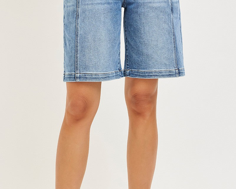 NEWYORKLISTED STYLE COLLECTION: Denim shorts worn by a person on a plain background