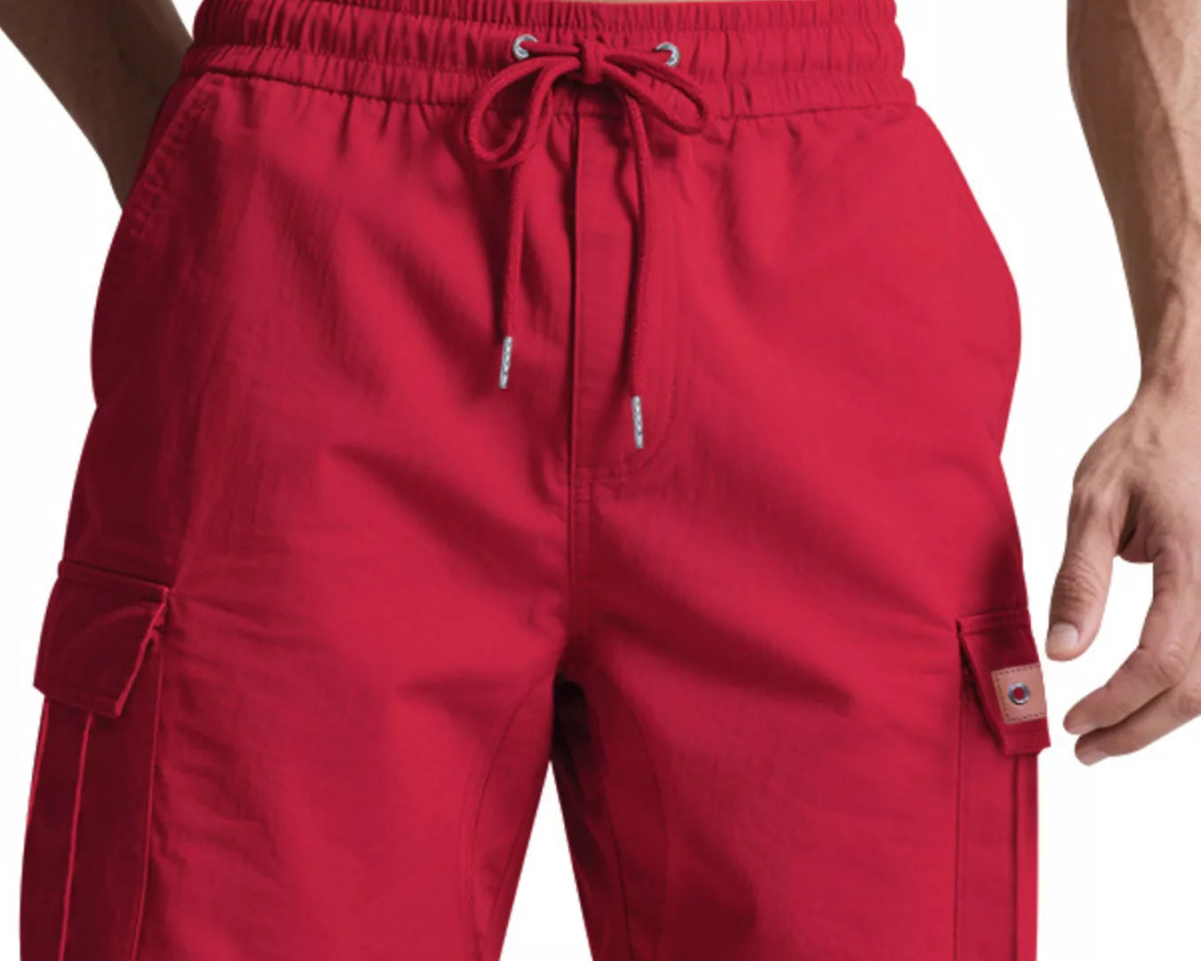 NEWYORKLISTED ATLAS MEN'S COLLECTION: Red cargo shorts worn by a person on a white background