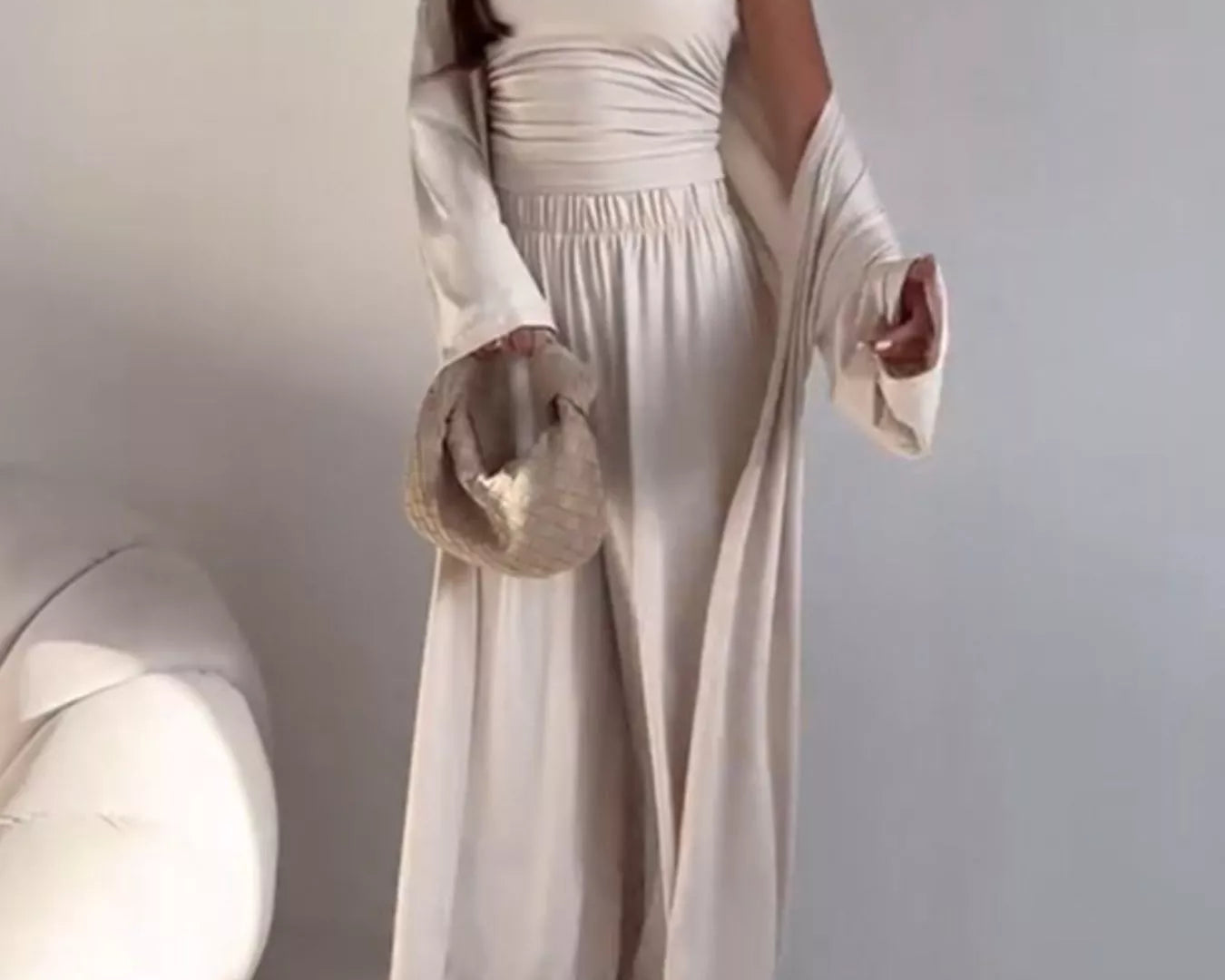 NEWYORKLISTED COMFORT COLLECTION: Woman wearing a white outfit with a plain background