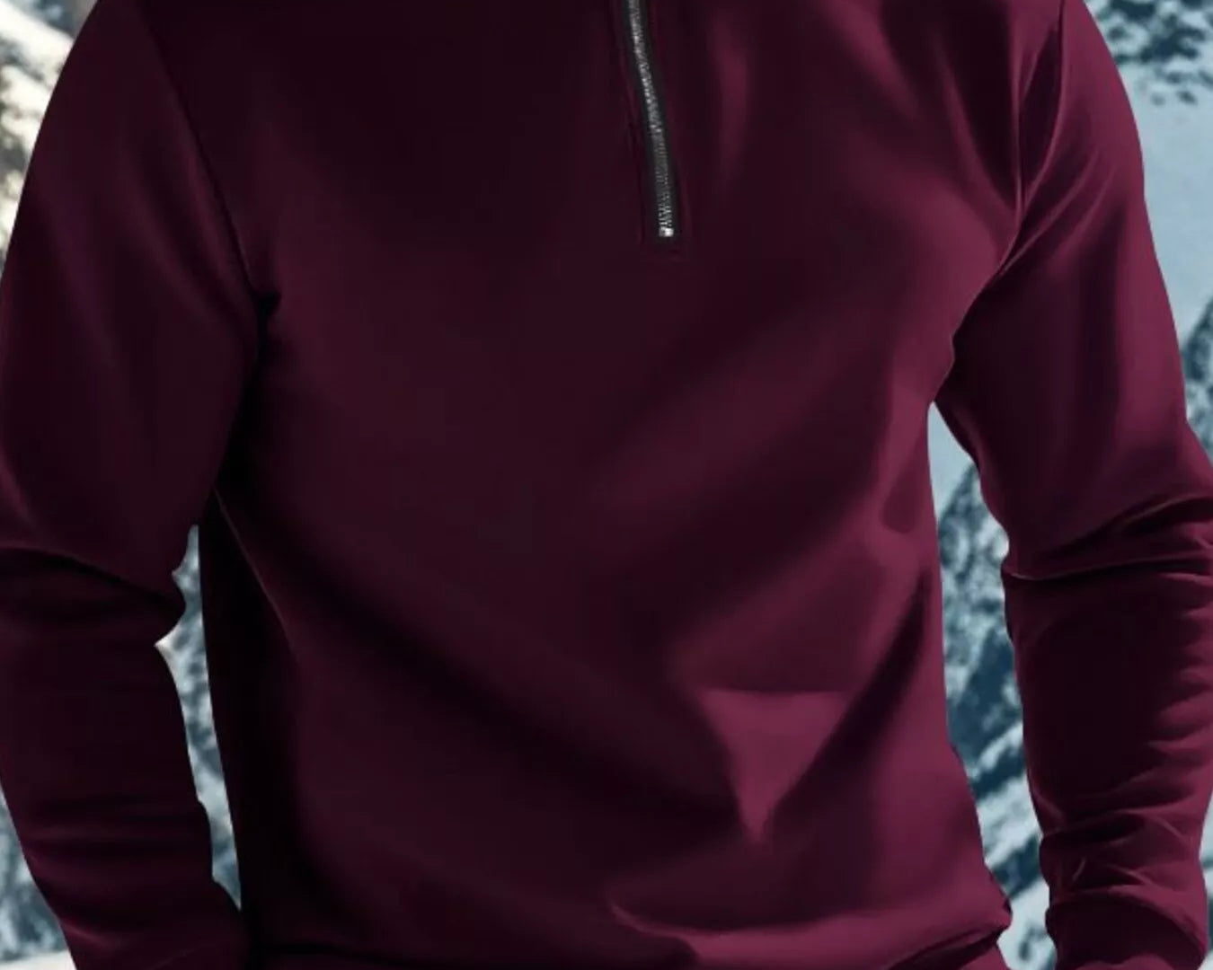 NEWYORKLISTED ATLAS MEN'S COLLECTION: Person wearing a maroon pullover with a zipper in a snowy mountain landscape