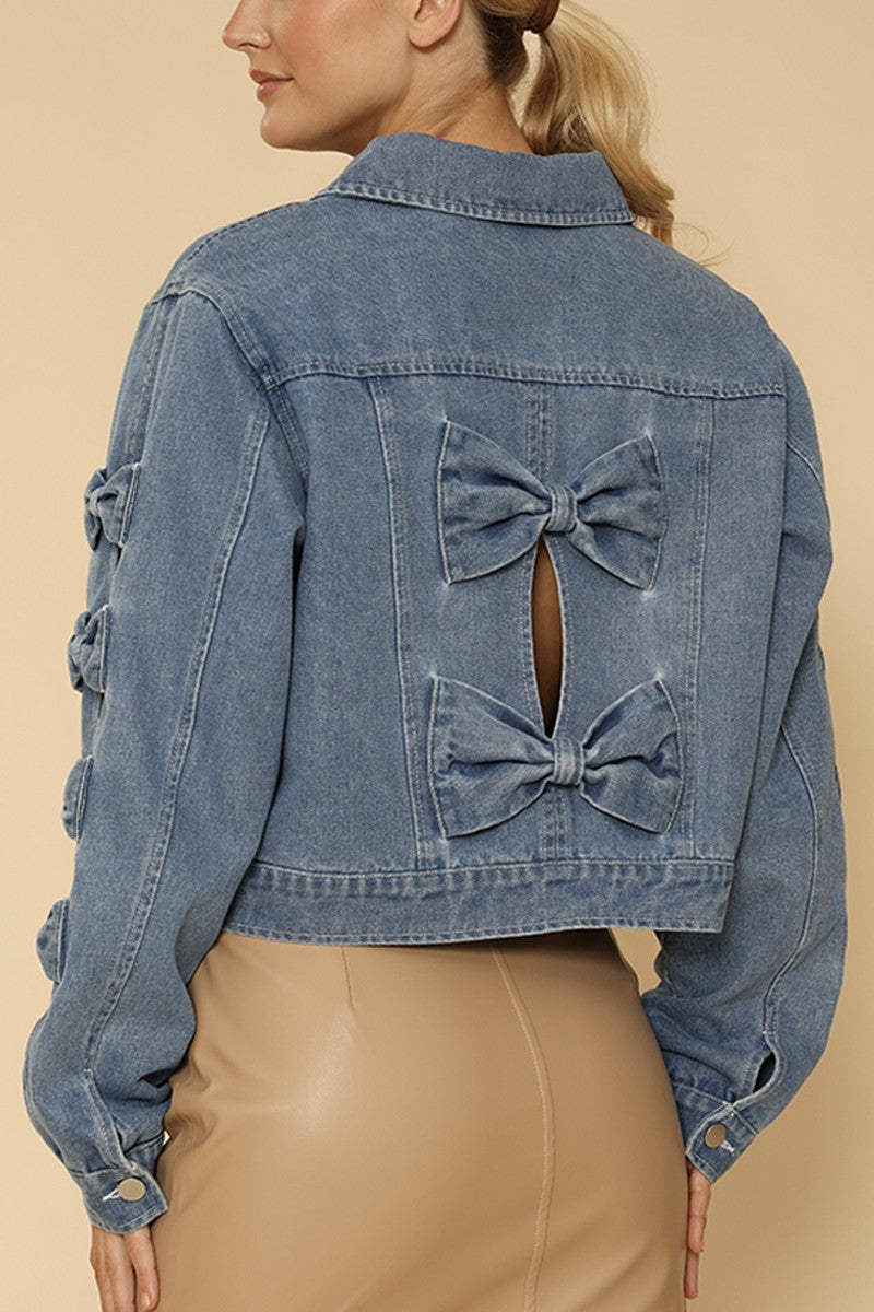NEWYORKLISTED STYLE COLLECTION: Blue denim jacket with bow details on a beige background