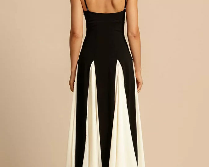 NEWYORKLISTED STYLE COLLECTION: Woman wearing a black and white jumpsuit on a beige background