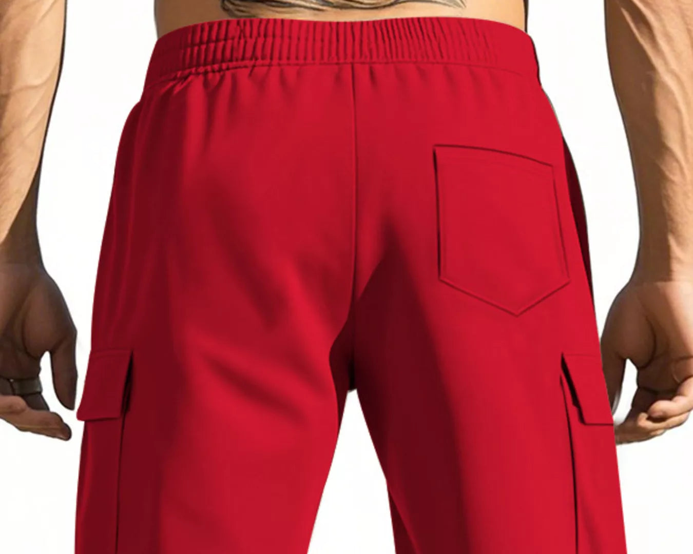 NEWYORKLISTED ATLAS MEN'S COLLECTION: Red cargo shorts worn by a person with tattoos on a plain background