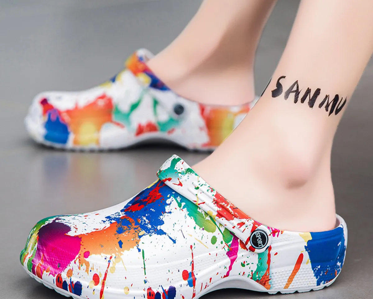 NEWYORKLISTED STYLE COLLECTION: Colorful splatter paint clogs worn by a person on a gray background