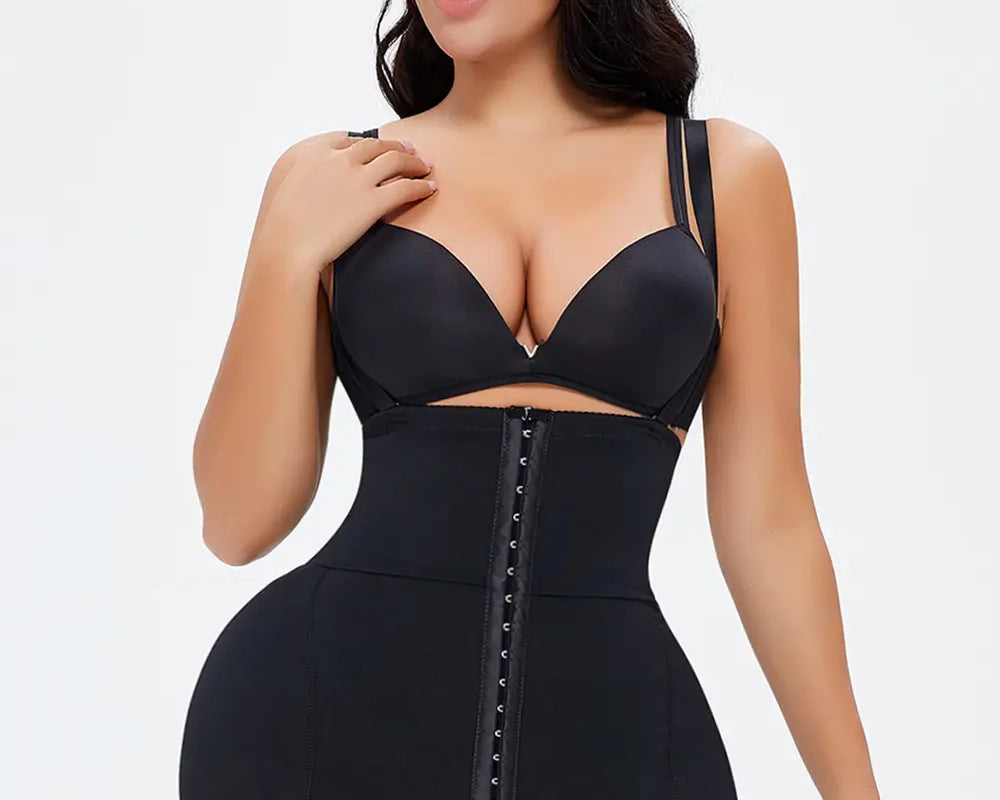 NEWYORKLISTED Intimate Apparel: Woman wearing a black shapewear bodysuit on a white background