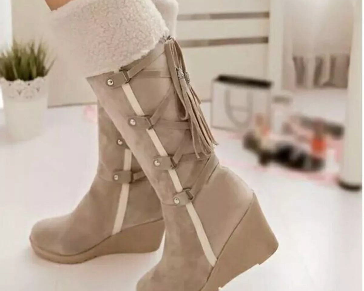 NEWYORKLISTED SHOE COLLECTION: Beige wedge boots with white fur lining worn indoors.