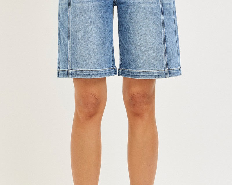 NEWYORKLISTED STYLE COLLECTION: Denim shorts worn by a person on a white background