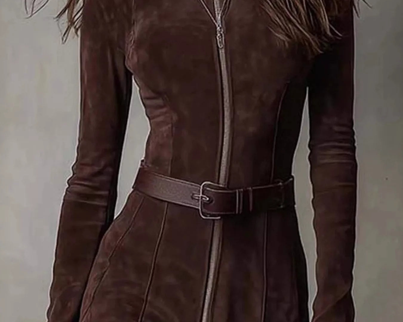 NEWYORKLISTED STYLE COLLECTION: Brown suede jumpsuit worn by a person against a neutral background