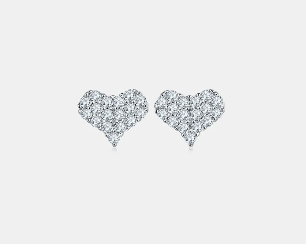 NYLD Glamour Collection By NEWYORKLISTED: Heart-shaped diamond earrings on a light gray background