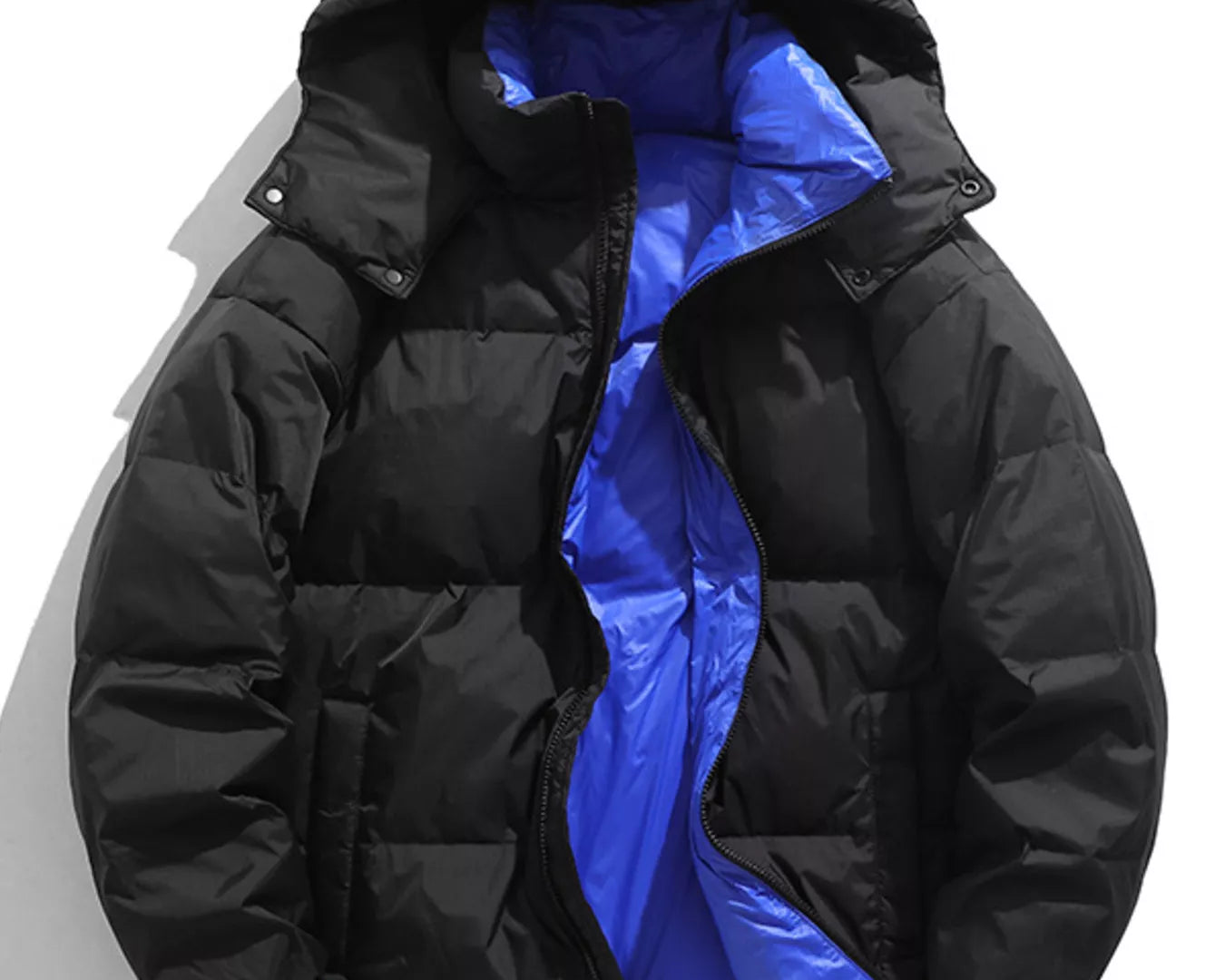 NEWYORKLISTED ATLAS MEN’S COLLECTION: Black puffer jacket with blue interior on a white background