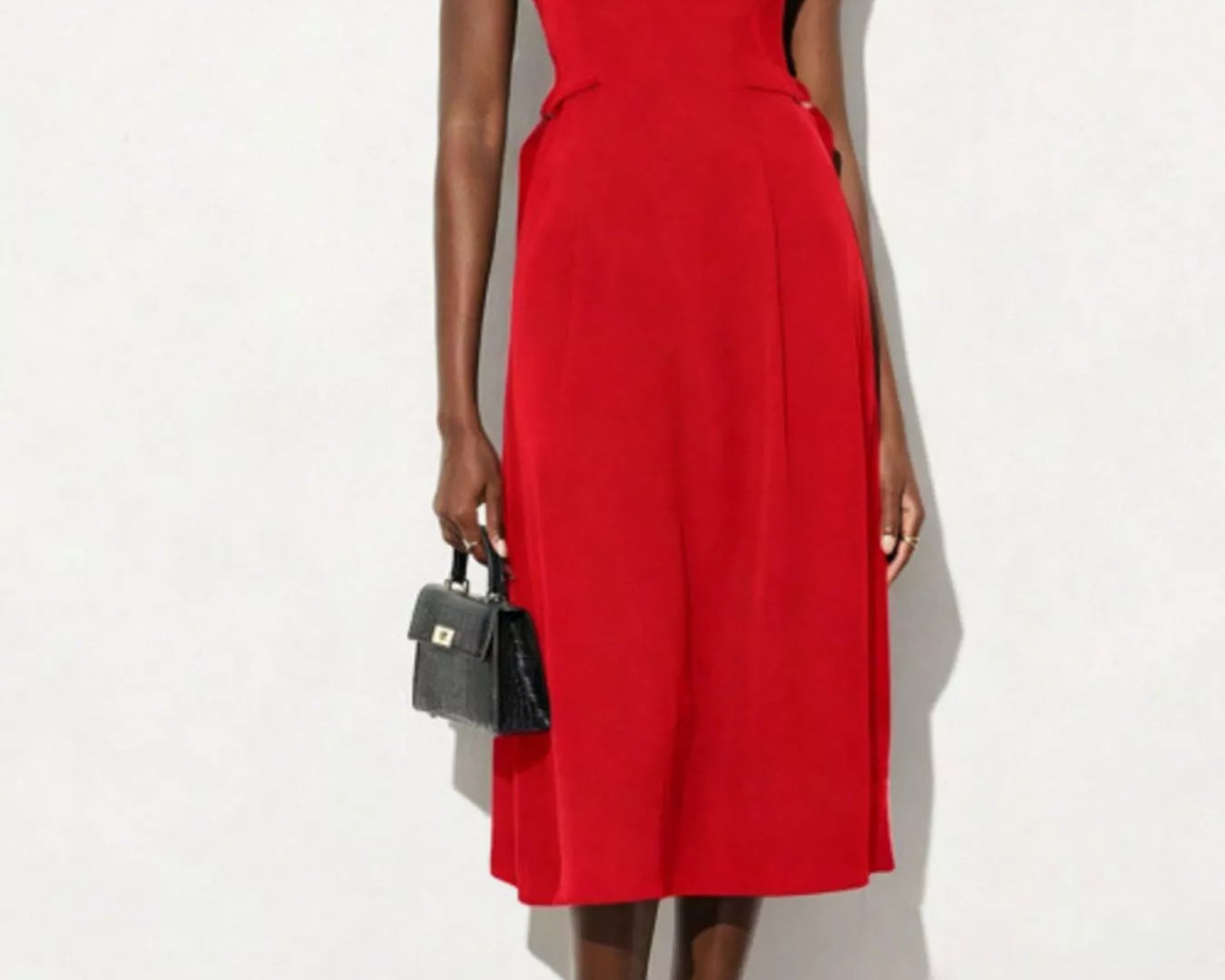 NEWYORKLISTED STYLE COLLECTION: Red dress worn by a model on a white background