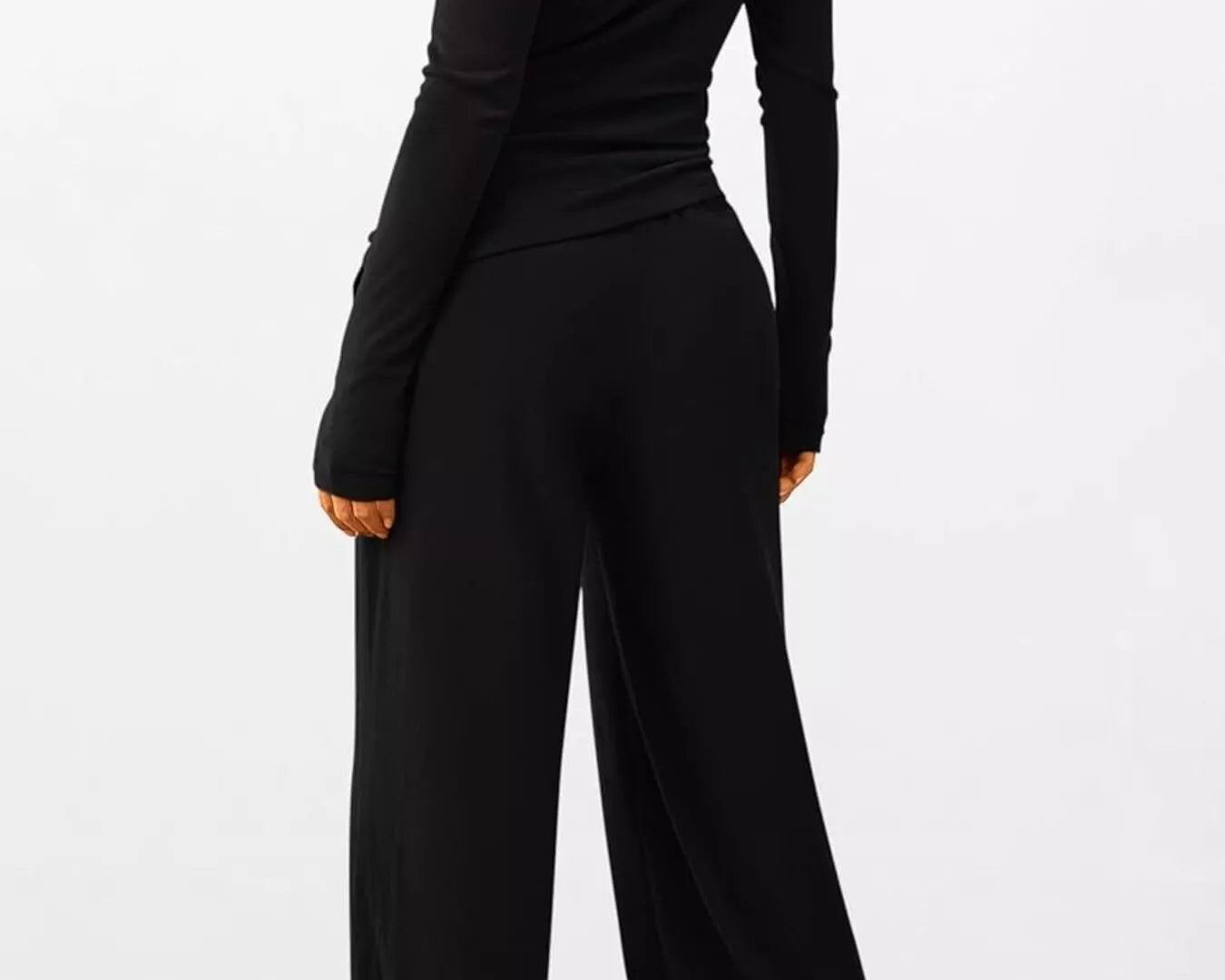 NEWYORKLISTED COMFORT COLLECTION: Long Sleeve Top and Wide Leg Pants Set: Black jumpsuit worn by a person on a white background