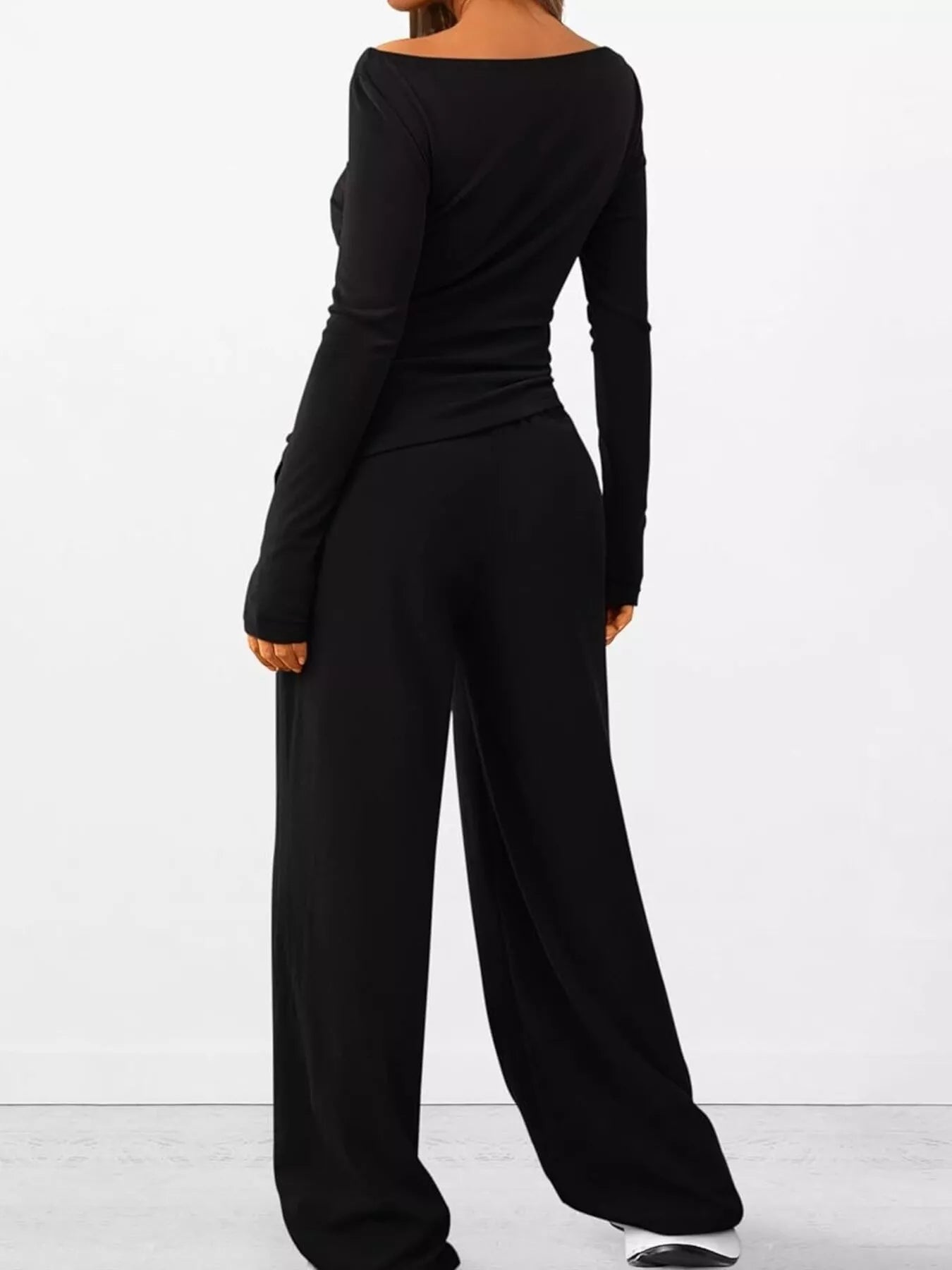 NEWYORKLISTED COMFORT COLLECTION: Long Sleeve Top and Wide Leg Pants Set: Black jumpsuit worn by a person on a white background