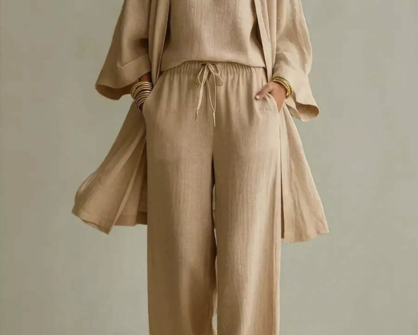 NEWYORKLISTED STYLE COLLECTION: Beige outfit with a top and pants on a neutral background