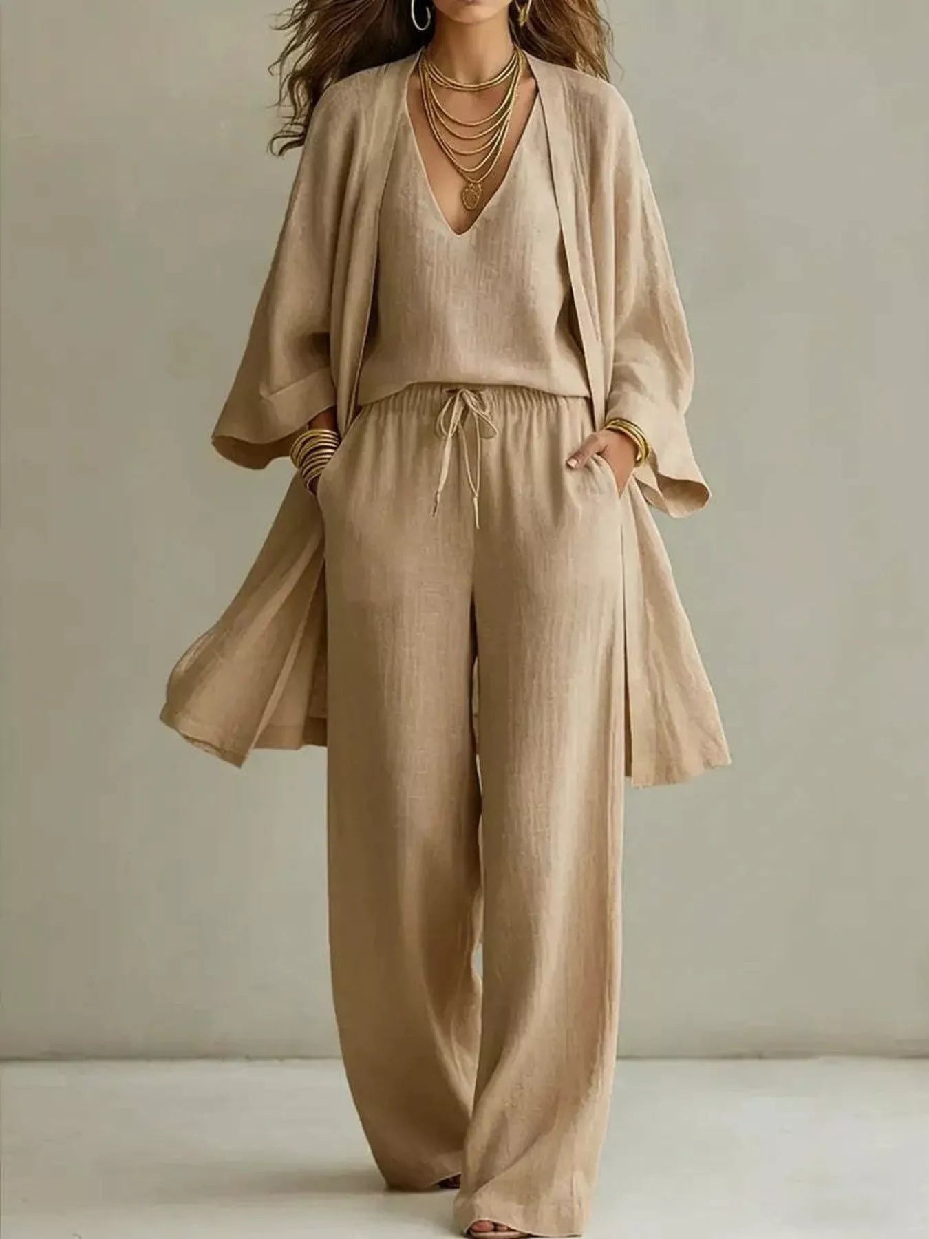 NEWYORKLISTED STYLE COLLECTION: Beige outfit with a top and pants on a neutral background