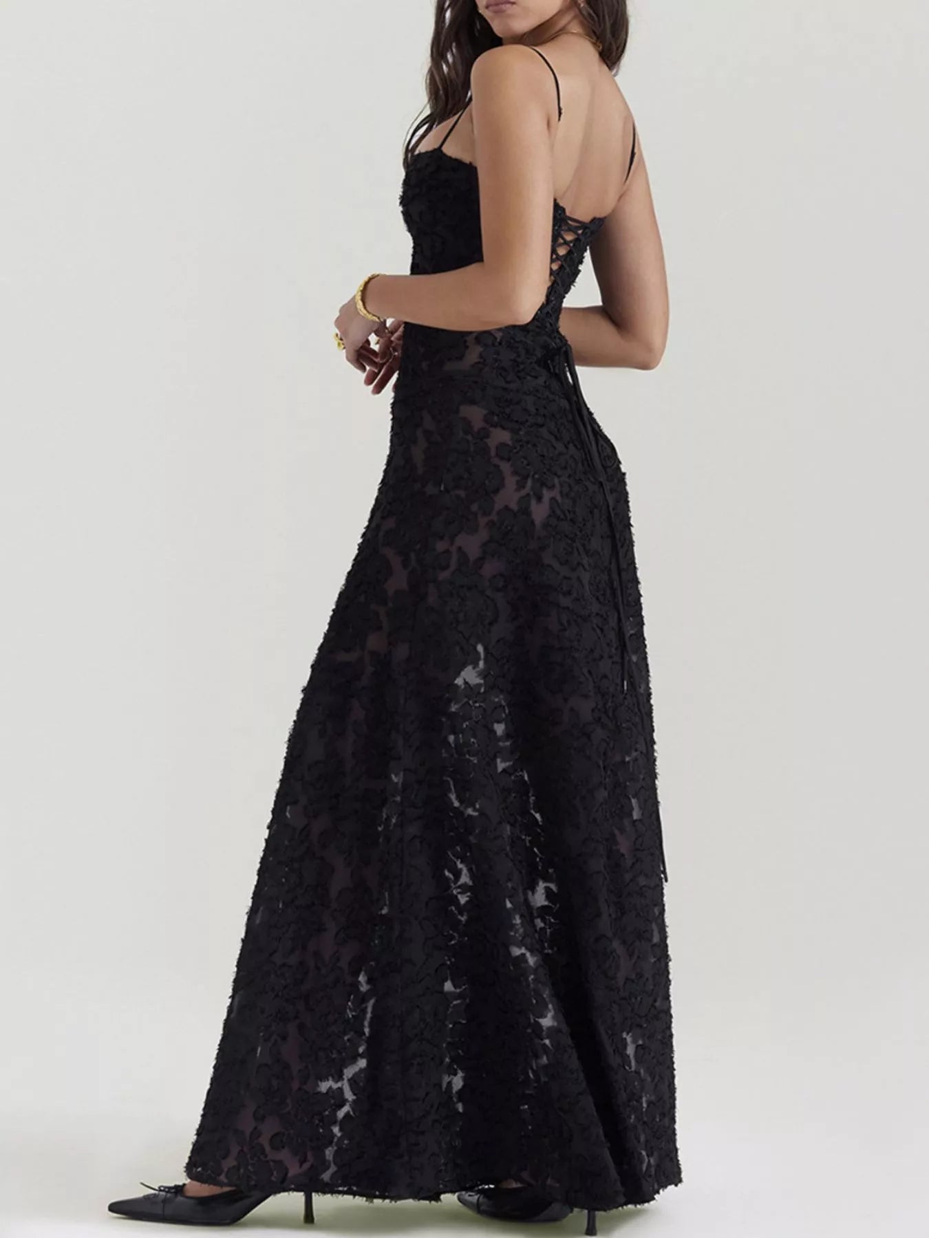 NEWYORKLISTED STYLE COLLECTION: Black lace dress worn by a person on a white background