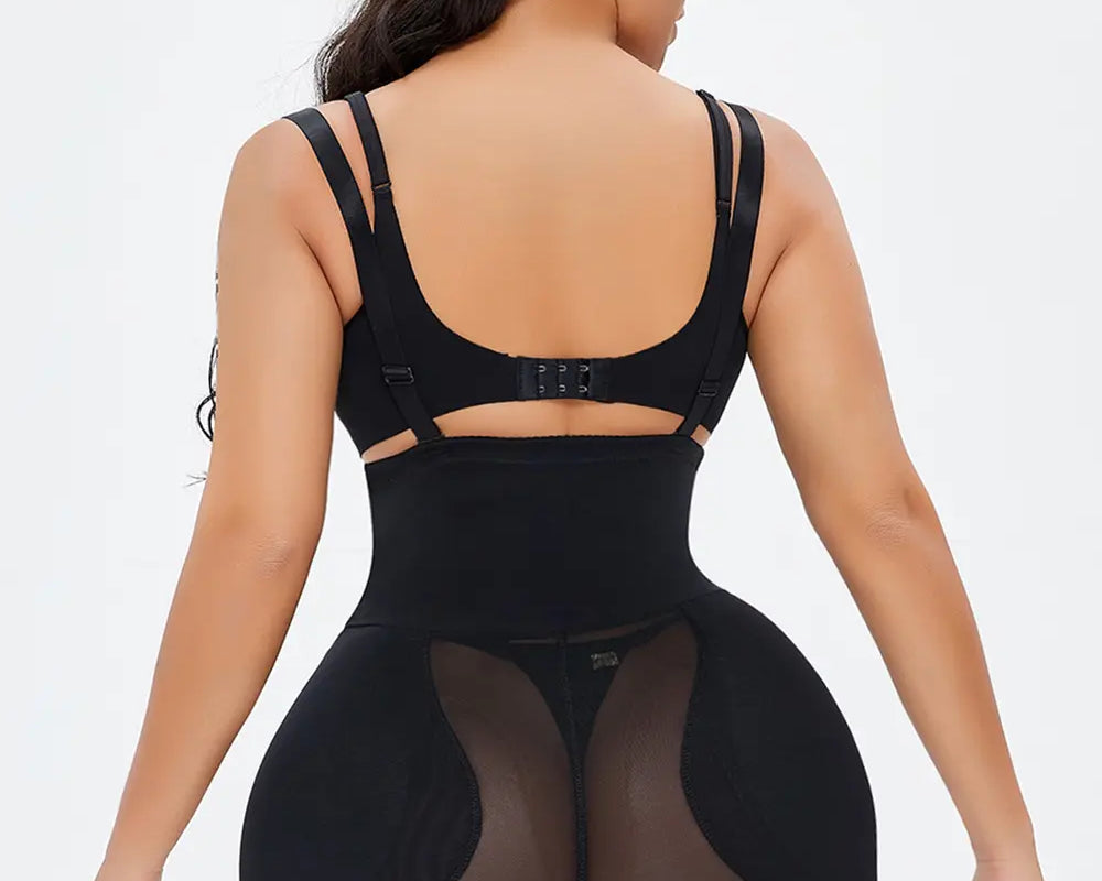 NEWYORKLISTED Intimate Apparel: Person wearing a black shapewear garment on a white background