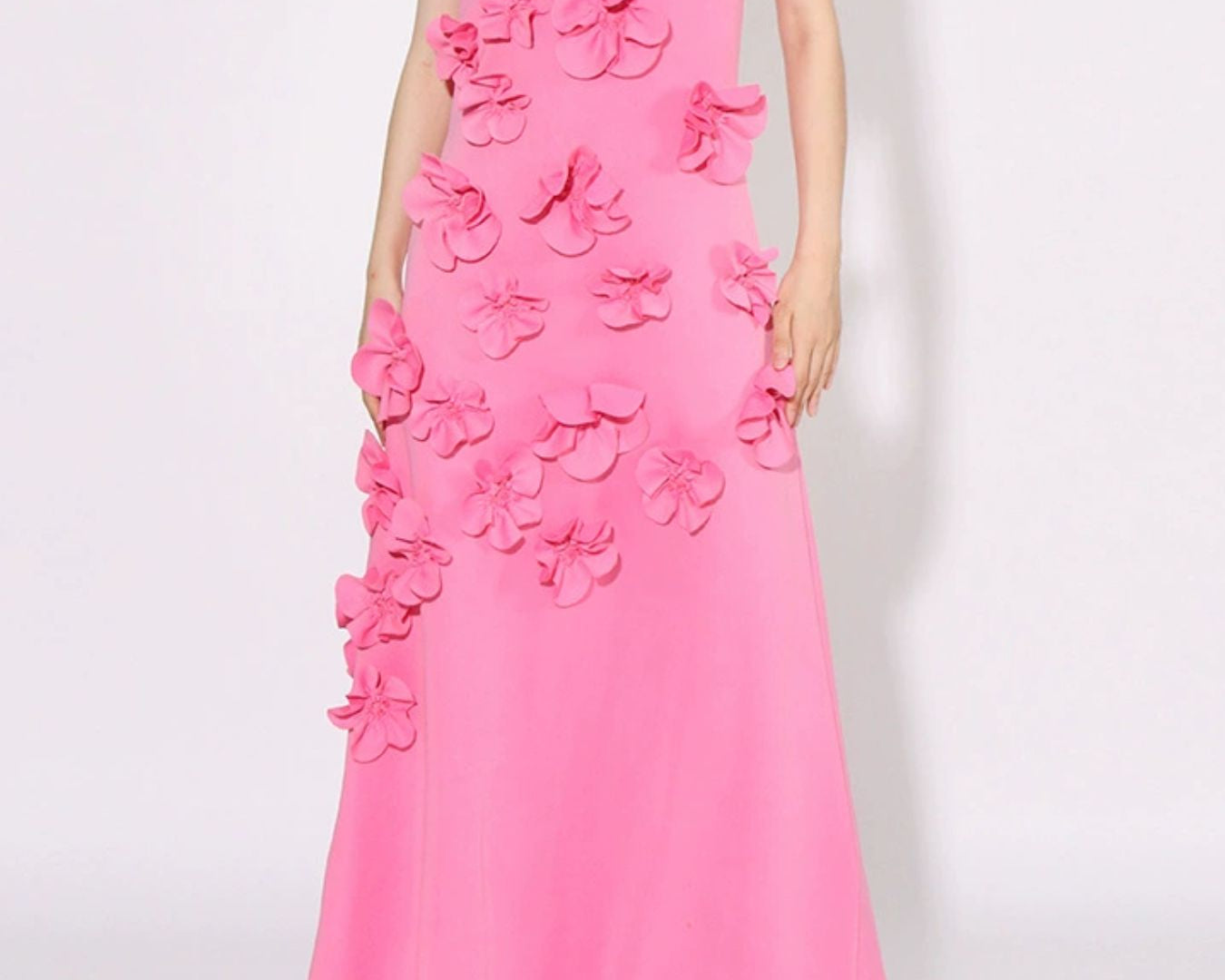 NEWYORKLISTED STYLE COLLECTION: Pink evening gown with floral embellishments on a white background