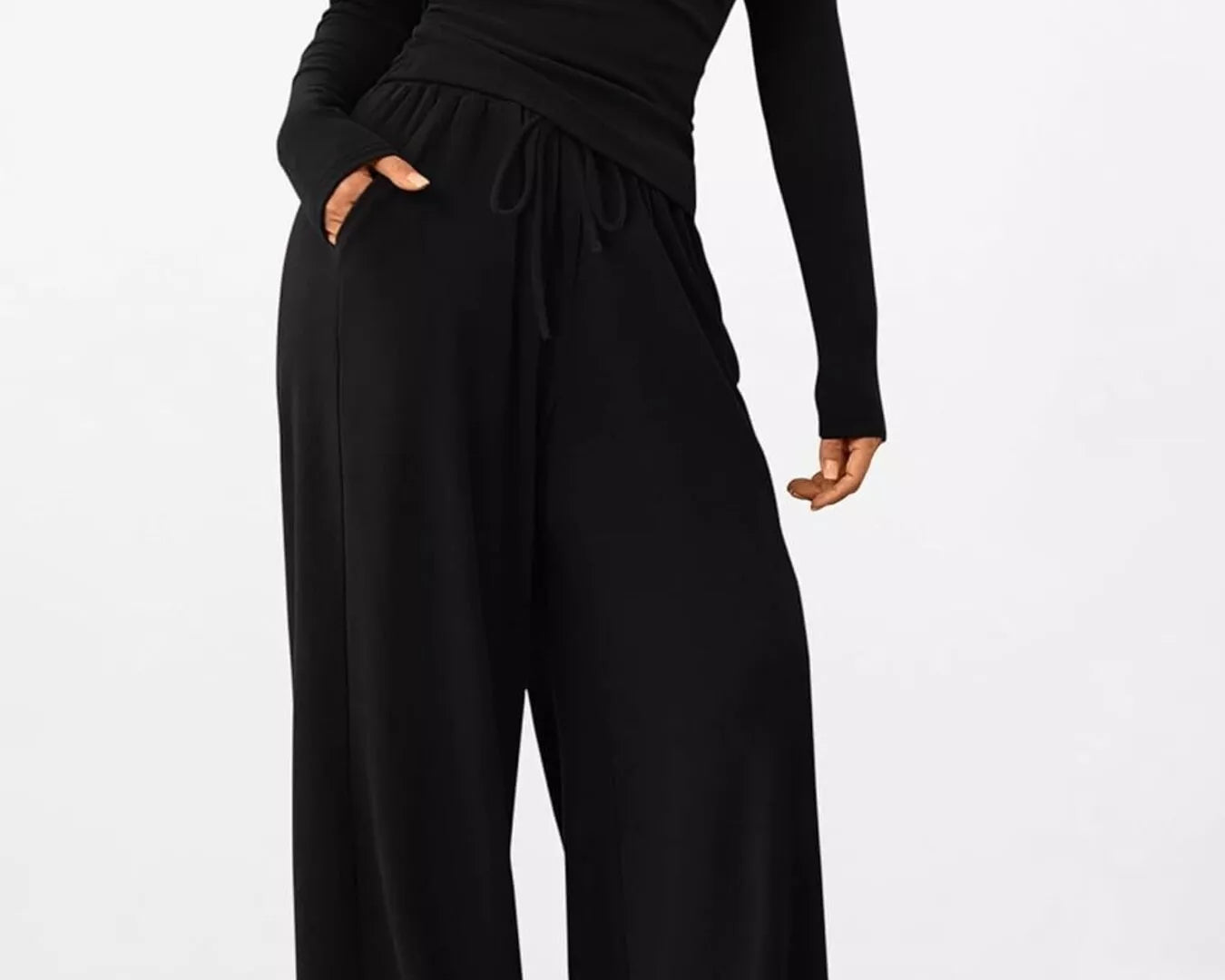 NEWYORKLISTED COMFORT COLLECTION: Long Sleeve Top and Wide Leg Pants Set: Black jumpsuit worn by a person on a white background