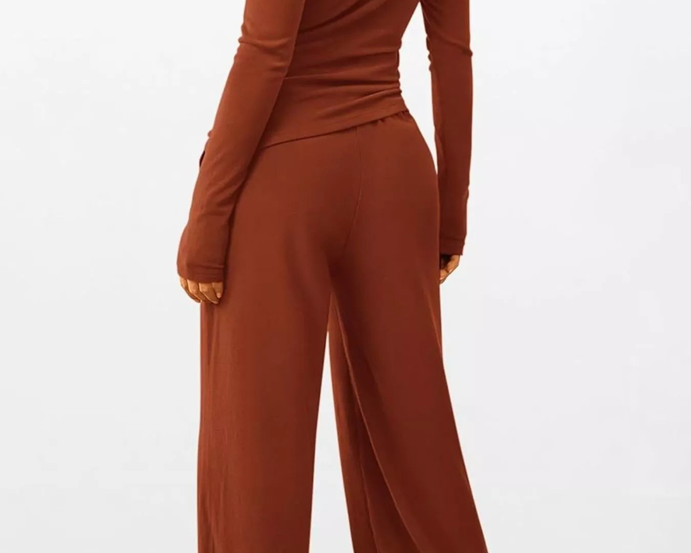 Brown long-sleeve top and wide-leg pants set on a white background
