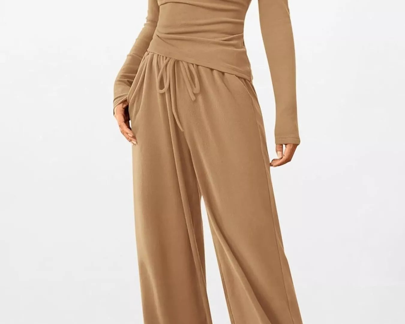 Brown jumpsuit with long sleeves and wide-leg pants on a white background