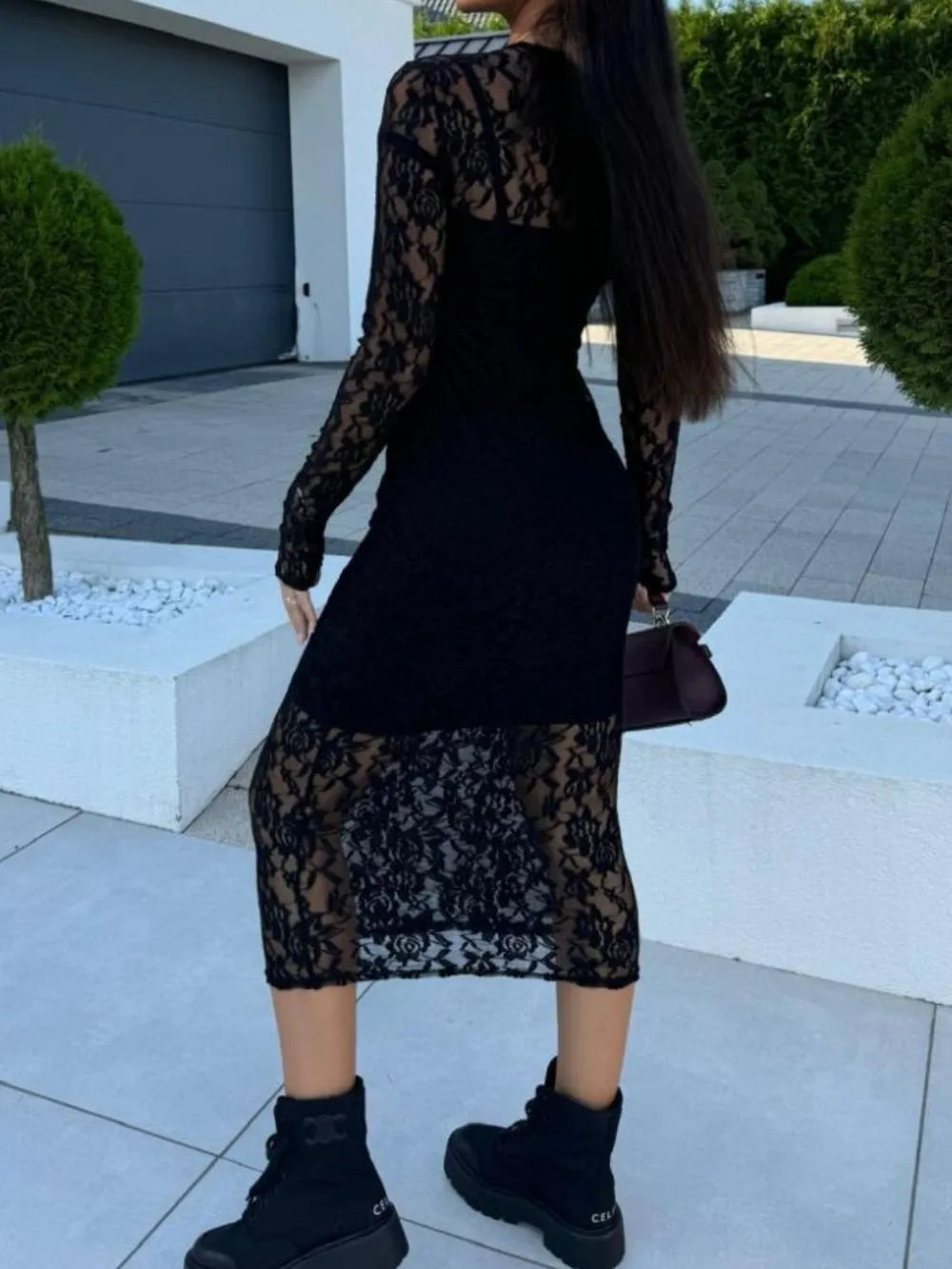NEWYORKLISTED Valentine's Day Specials: Person wearing a black lace dress in an outdoor setting