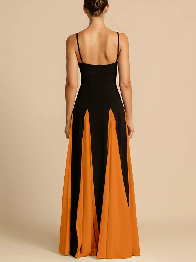 NEWYORKLISTED STYLE COLLECTION: Woman wearing a black and orange dress with a beige background