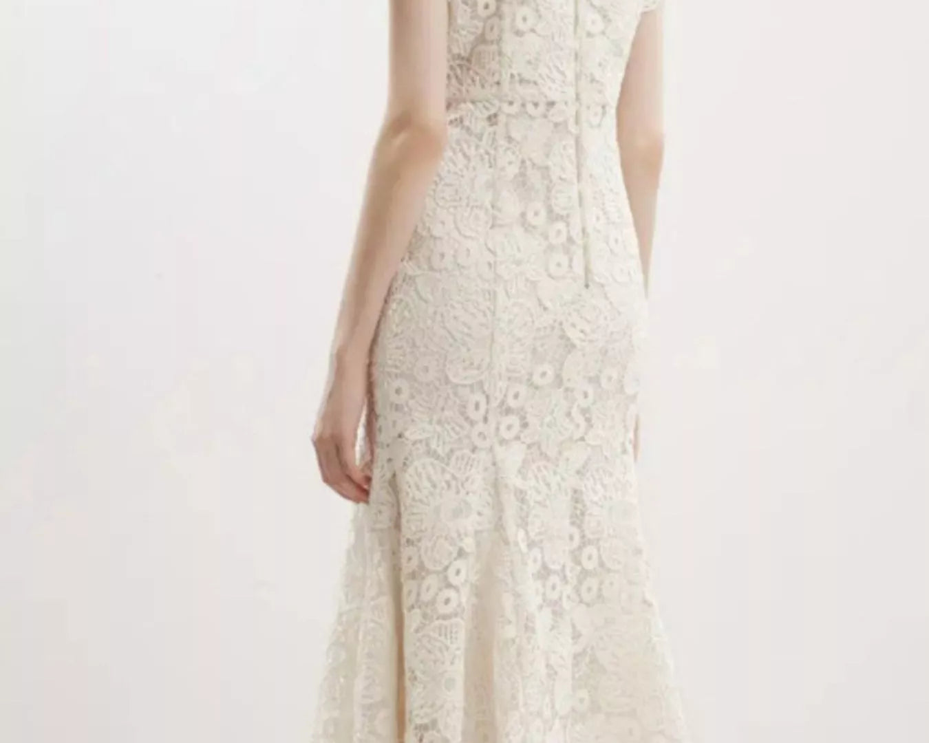 NEWYORKLISTED STYLE COLLECTION: White lace dress on a white background