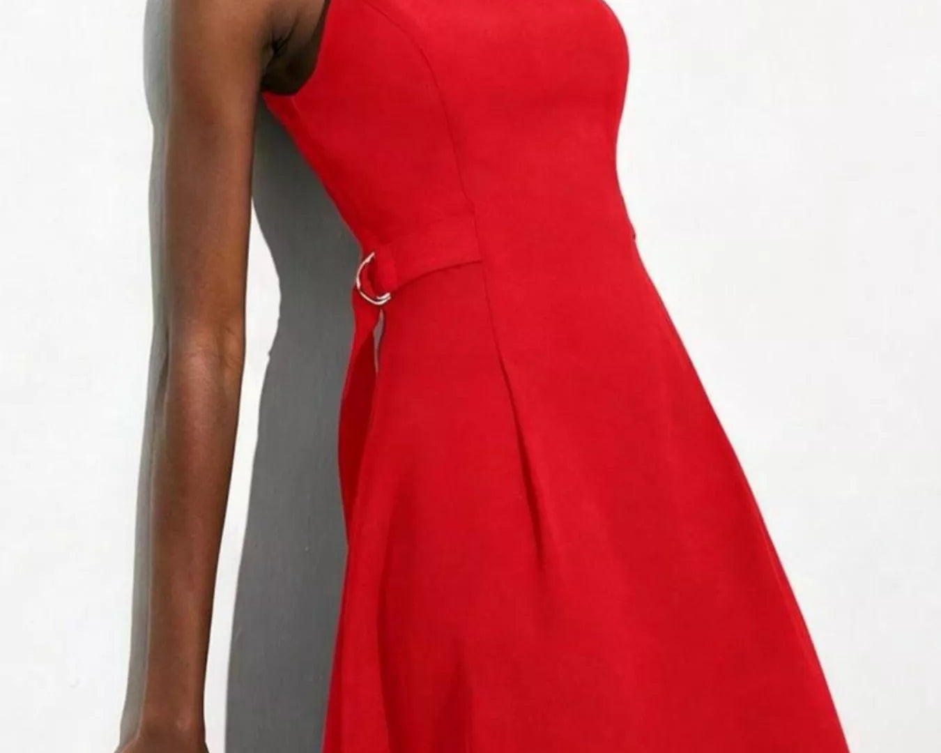 NEWYORKLISTED STYLE COLLECTION: Red dress worn by a model against a white background