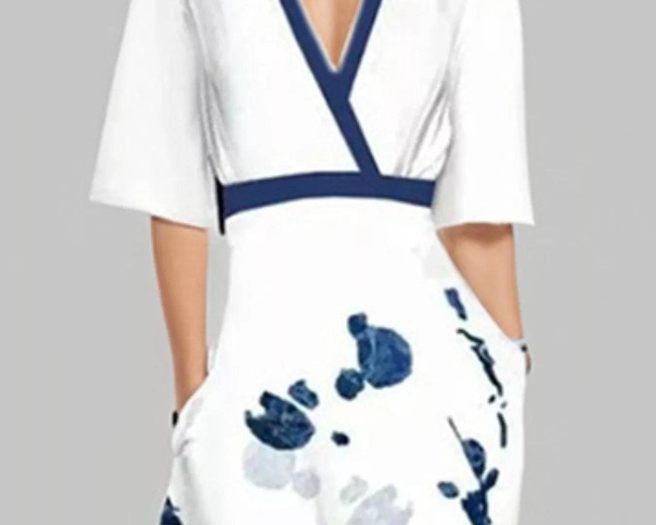 NEWYORKLISTED STYLE COLLECTION: White dress with blue floral pattern and neckline on a gray background